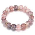 Healing Bead Bracelet—A rose quartz and chakra crystal bracelet that helps relieve anxiety and reduce stress; this soothing, stretchy bracelet calms both body and mind, making it perfect for yoga, meditation, and everyday wear