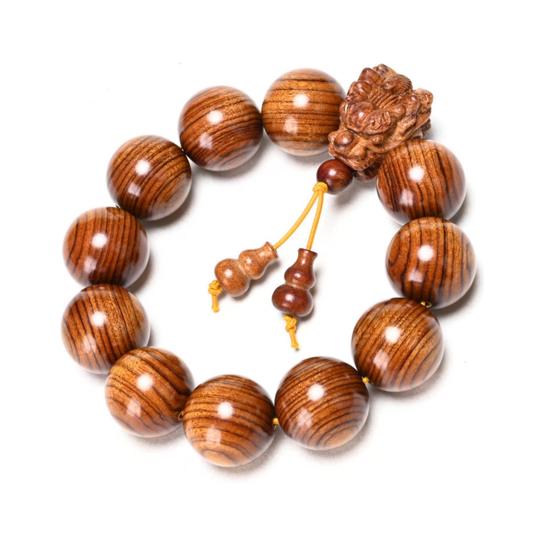 A 20-millimeter-diameter bracelet made of 12 hand-carved wooden beads, adorned with a carved dragon design