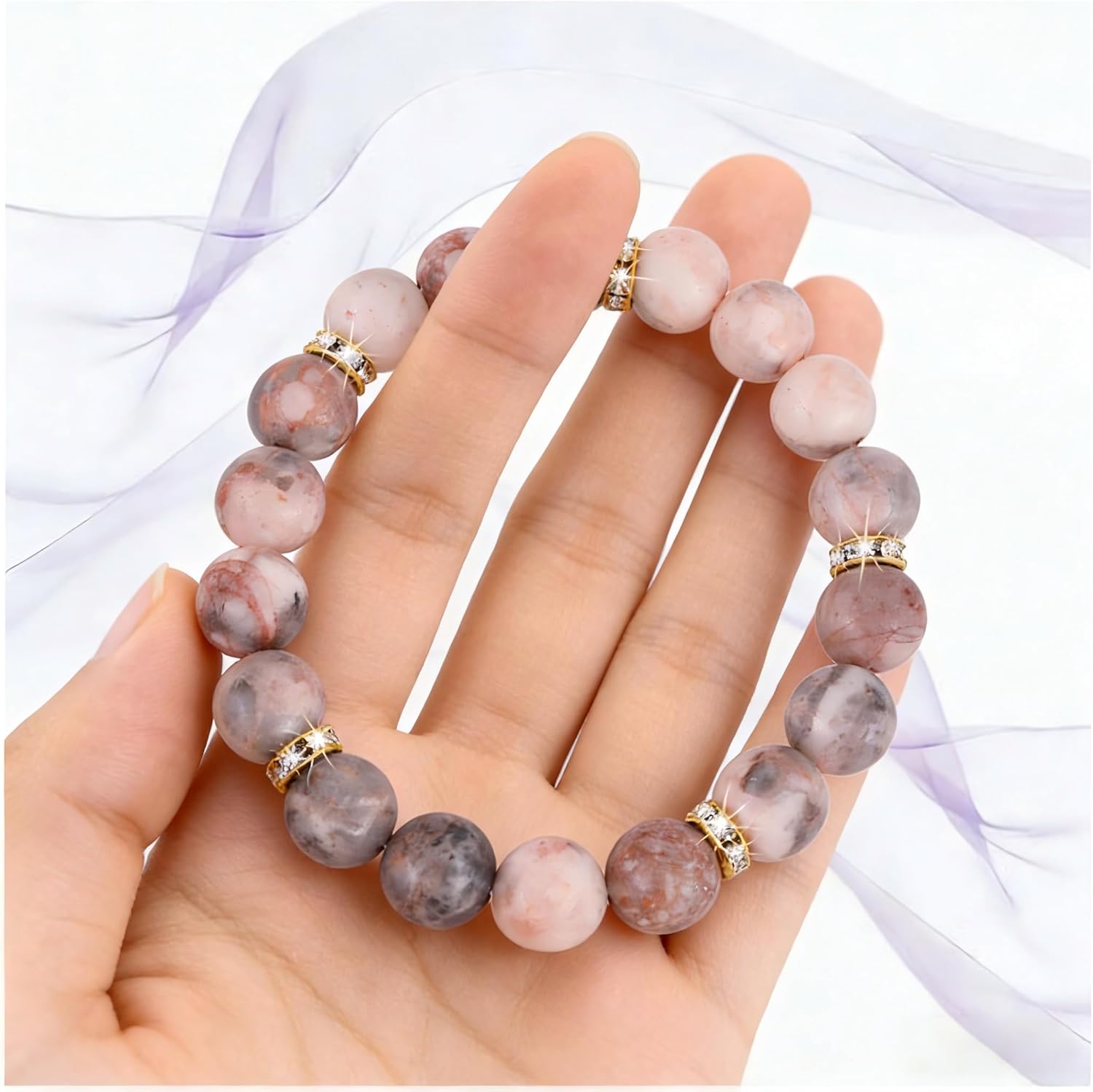 Healing Bead Bracelet—A rose quartz and chakra crystal bracelet that helps relieve anxiety and reduce stress; this soothing, stretchy bracelet calms both body and mind, making it perfect for yoga, meditation, and everyday wear