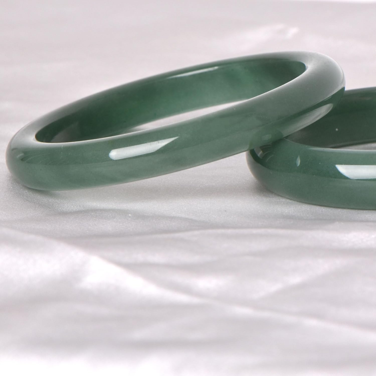 Green natural jade bracelet, known for its healing, protective, and wealth-attracting properties; natural gemstone feng shui jewelry
