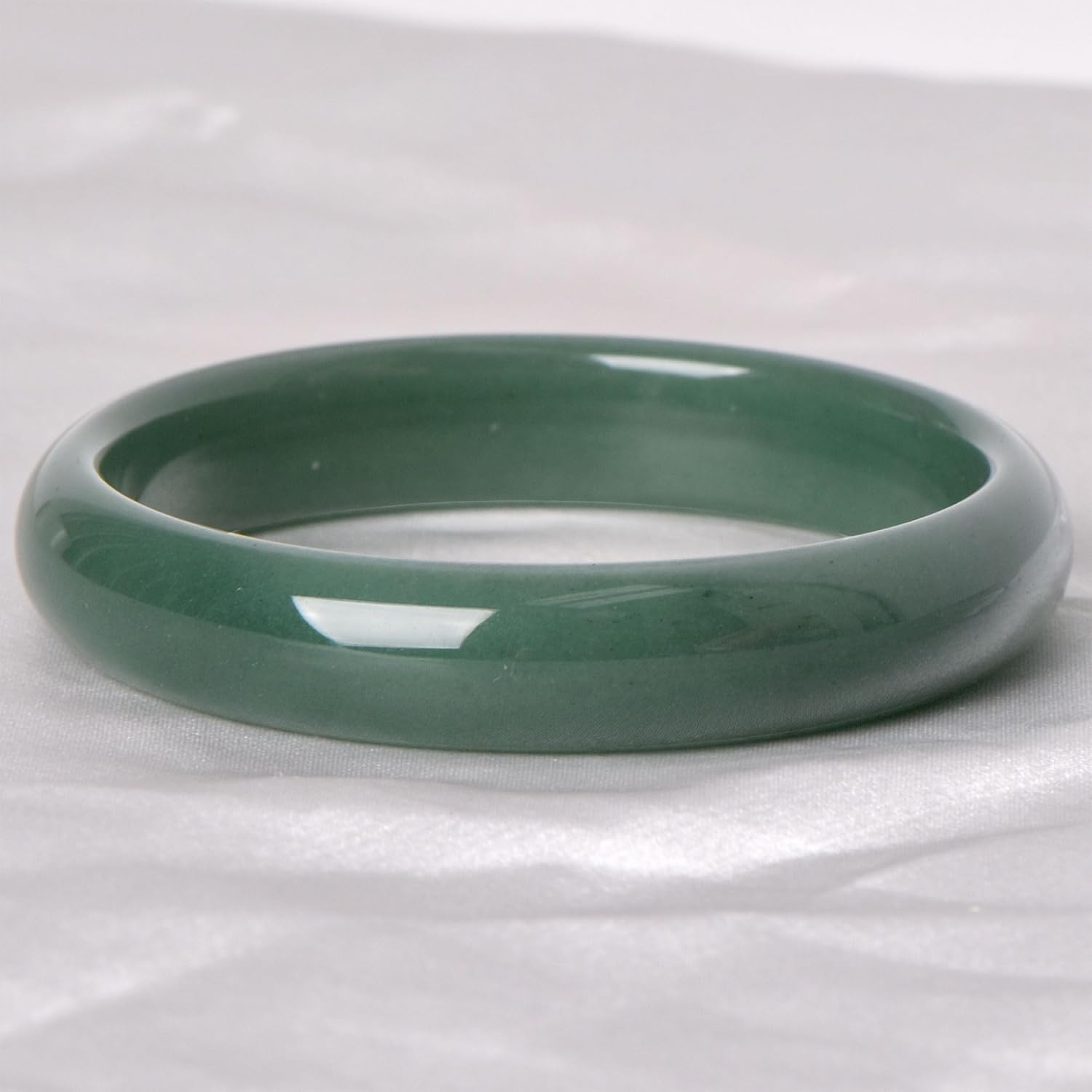 Green natural jade bracelet, known for its healing, protective, and wealth-attracting properties; natural gemstone feng shui jewelry