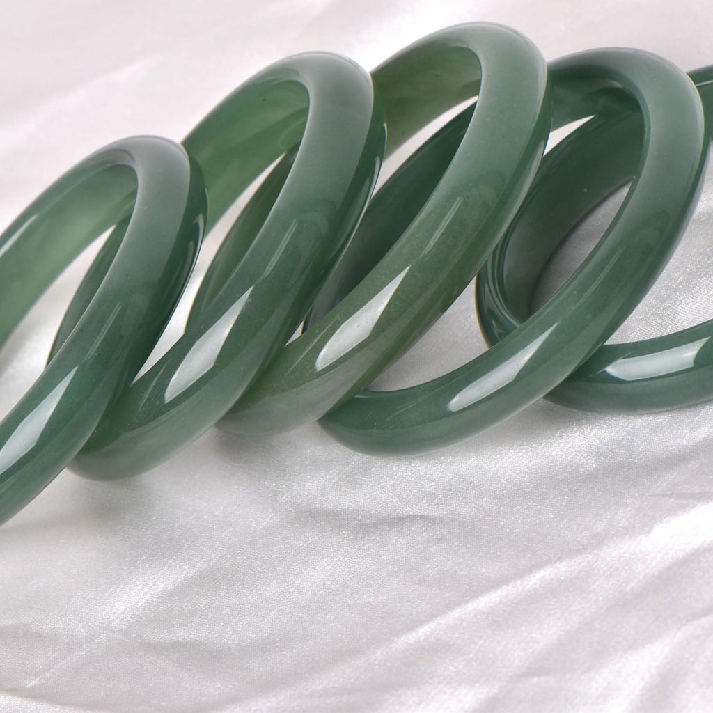 Green natural jade bracelet, known for its healing, protective, and wealth-attracting properties; natural gemstone feng shui jewelry